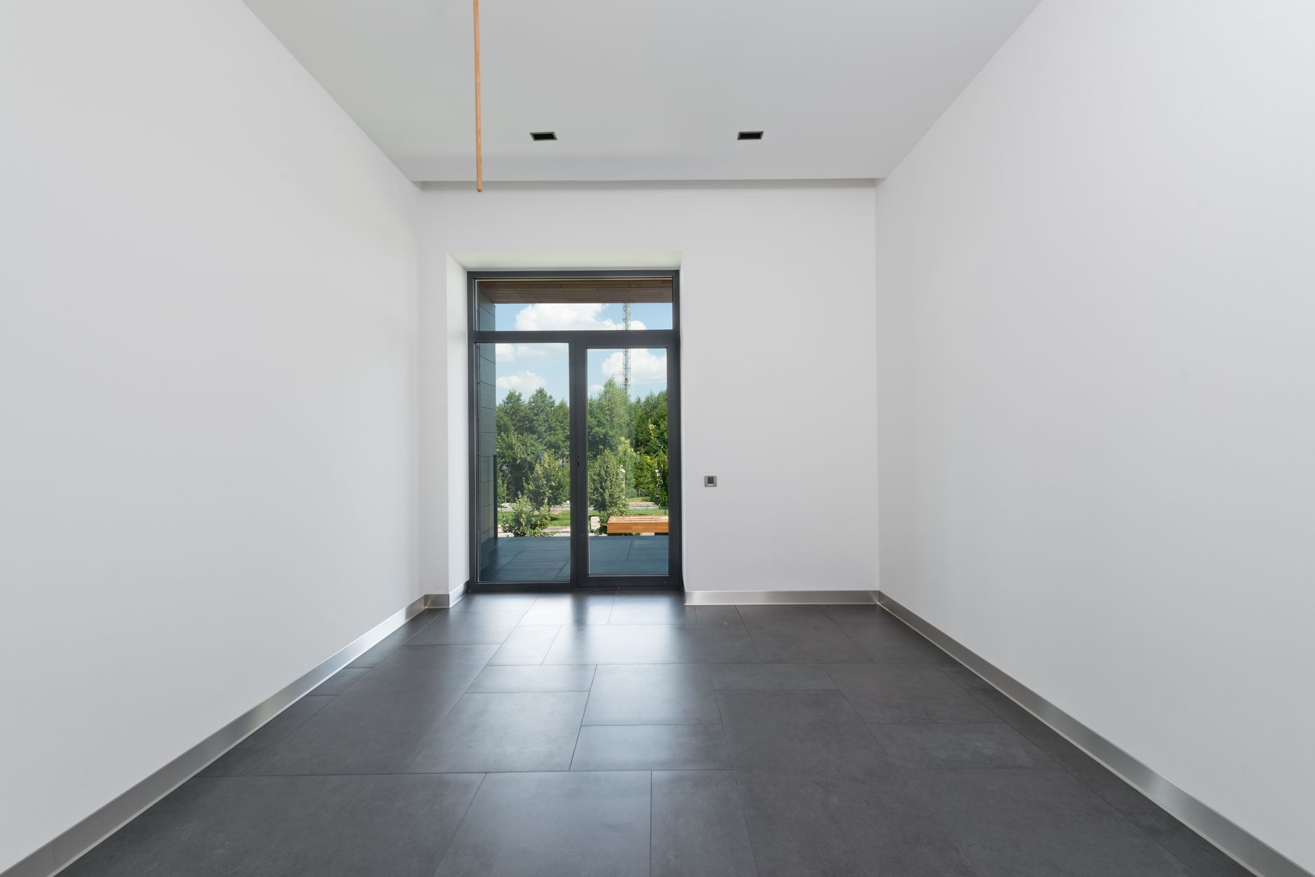 An office interior, the same surfaces as a house on a timetable set by trading hours.
