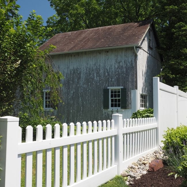 A timber fence coated on both faces, with the end grain done where water gets in first.
