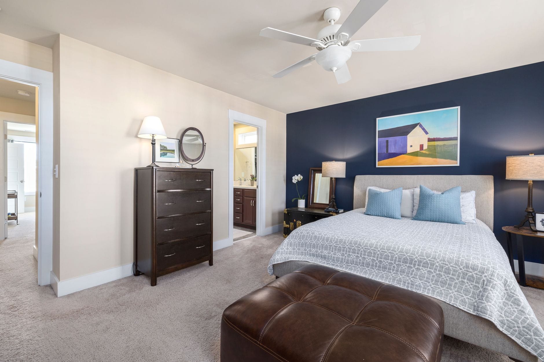 A bedroom finished in two tones, with the change of colour landing on a clean line.
